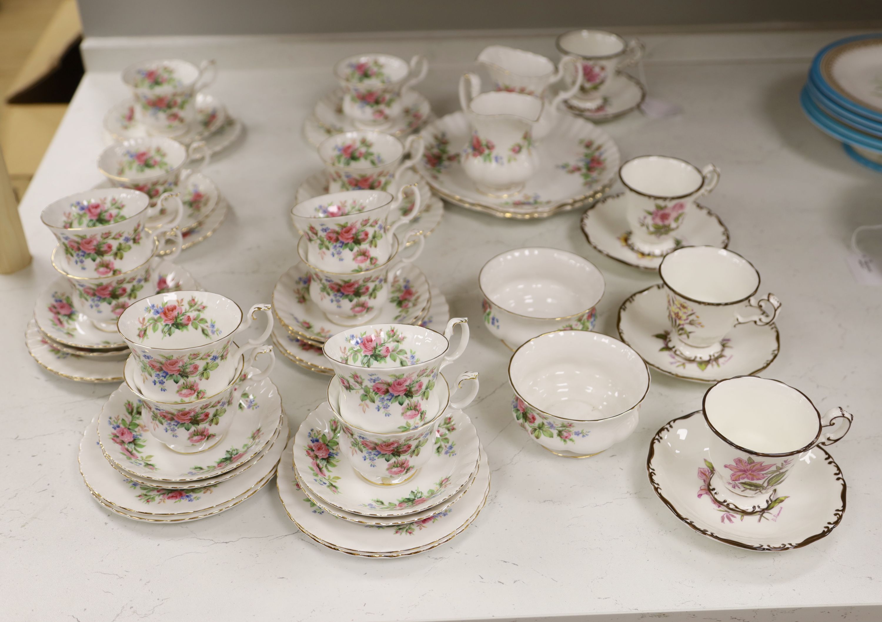 A Royal Albert Moss Rose pattern tea service (41-pce) and a set of four Coalport botanical cups and saucers